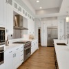 Kitchen with wood floors and white cabinets