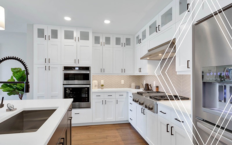 a kitchen with white cabinets