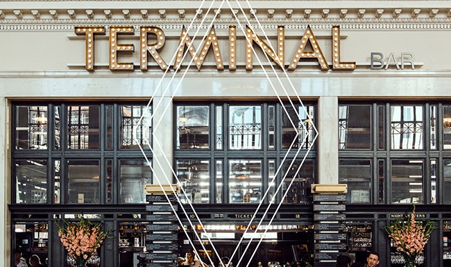 Find your perfect fit at The Pullman Union Station a large room with a chandelier and a clock on the ceiling