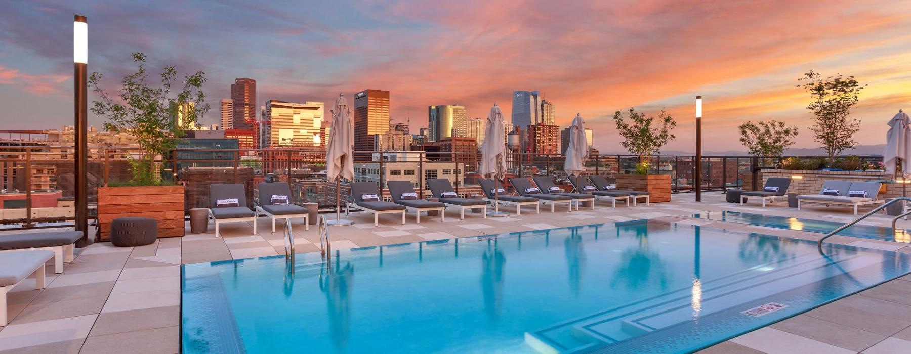 a pool with a city in the background