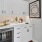 a kitchen with white cabinets at The Pullman Apartments in Denver, CO near Union Station