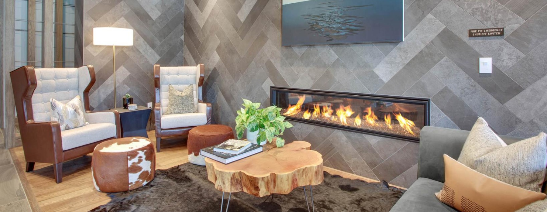 a living room with a fireplace at The Pullman Apartments in Denver, CO near Union Station