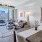 a living room with a large window with city views at The Pullman Apartments in Denver, CO near Union Station