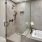 a bathroom with a glass shower at The Pullman Apartments in Denver, CO near Union Station