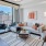 a living room with a large glass door at The Pullman Apartments in Denver, CO near Union Station