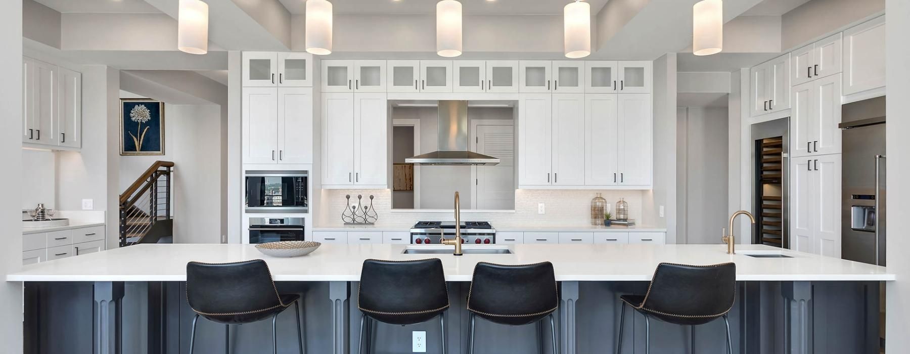 a kitchen with white cabinets