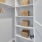 a white shelving unit with baskets in a large closet at The Pullman Apartments in Denver, CO near Union Station