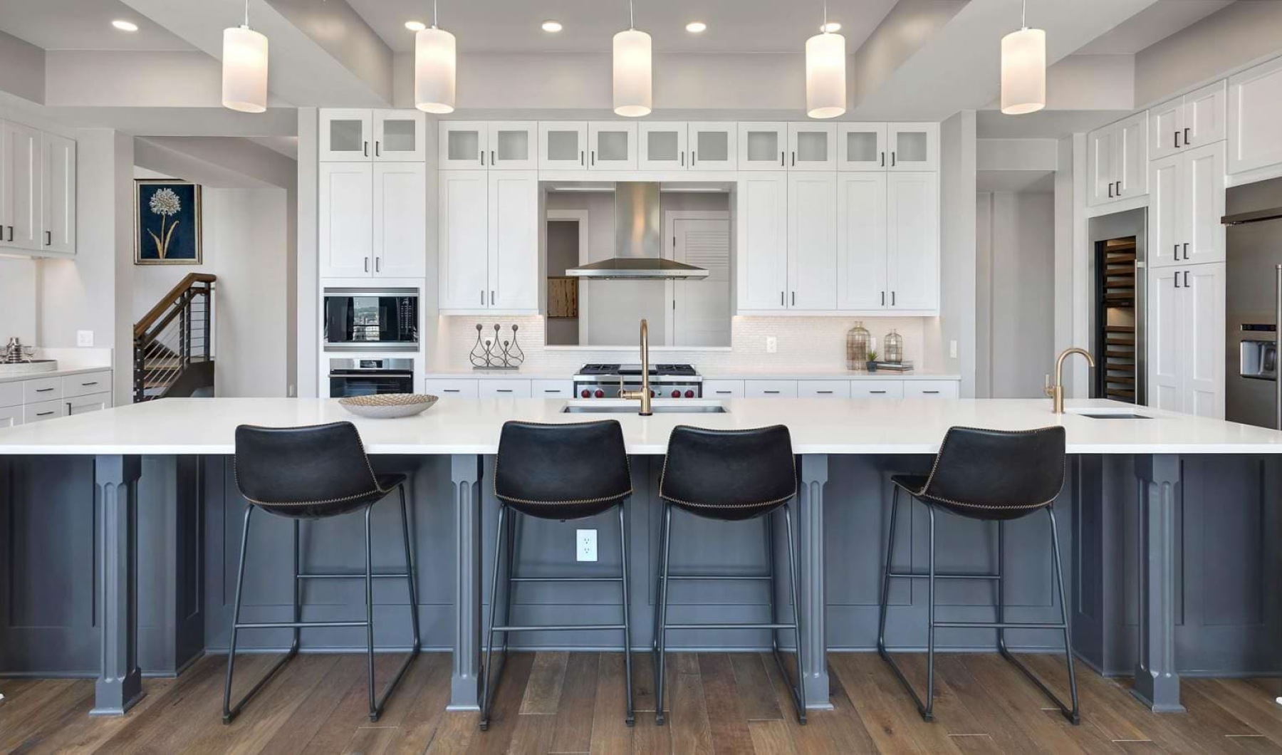 a kitchen with white cabinets at The Pullman Apartments in Denver, CO near Union Station