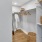a room with a white wall and door and baskets at The Pullman Apartments in Denver, CO near Union Station