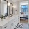a bathroom with a bed and a double vanity at The Pullman Apartments in Denver, CO near Union Station