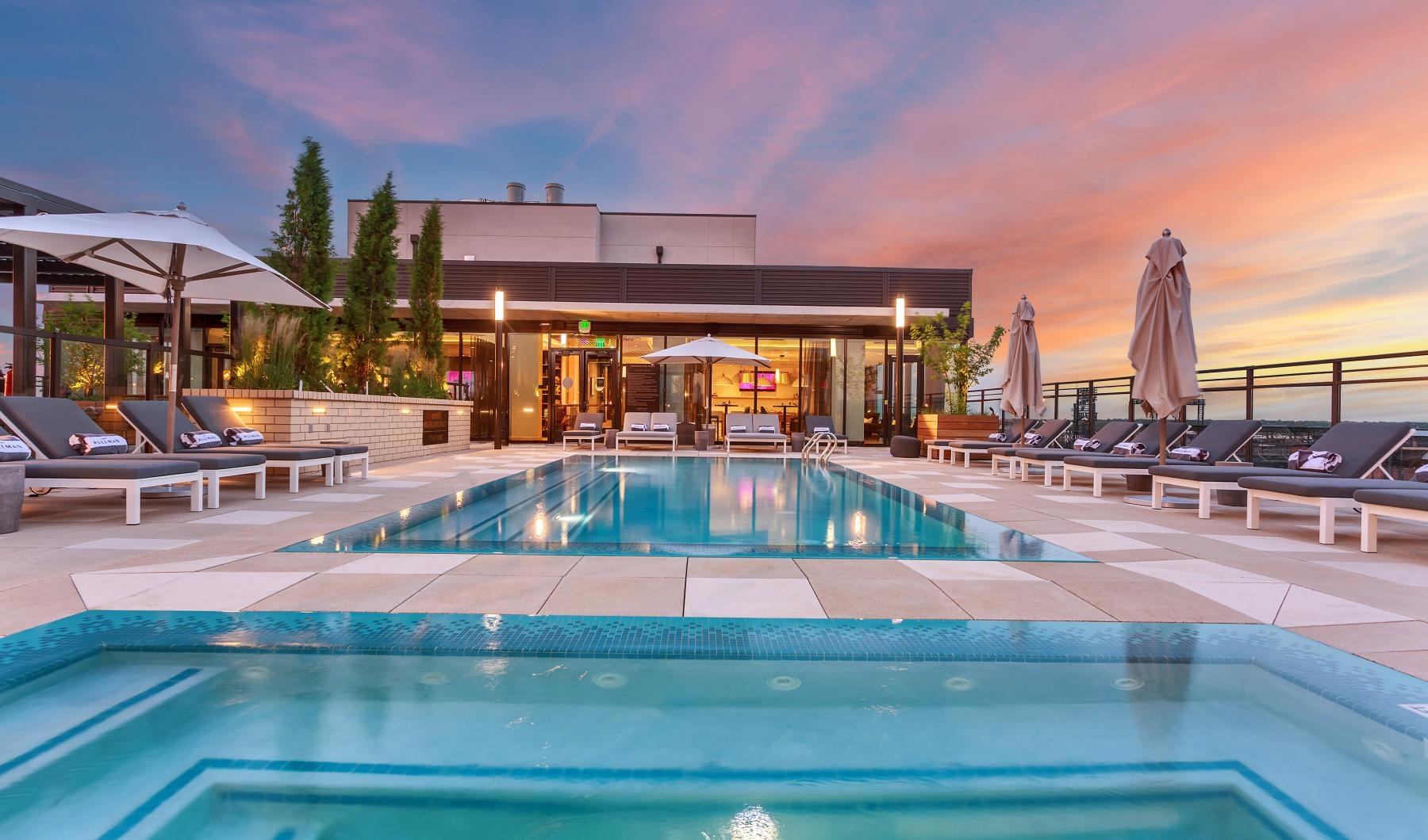 a swimming pool with a building in the background